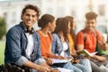 Study Together. Student Guy Preparing For Exams Outdoors With His University Friends Royalty Free Stock Photo