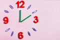 Study the topic of hours with children. The watch is made of numbers, paper clips, and sticks from a children learning kit