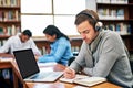 In the study zone. a university student working in the library at campus. Royalty Free Stock Photo