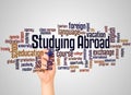 Studying abroad word cloud and hand with marker concept Royalty Free Stock Photo