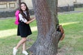 Studying animal in natural environment. Little child and cute squirrel sitting at tree. Animal science. Zoology. Back to
