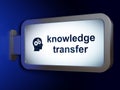Studying concept: Knowledge Transfer and Head With Gears on billboard background Royalty Free Stock Photo