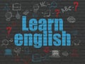 Studying concept: Learn English on wall background Royalty Free Stock Photo