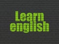 Studying concept: Learn English on wall background Royalty Free Stock Photo
