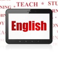 Studying concept: Tablet Computer with English on display Royalty Free Stock Photo