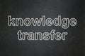 Studying concept: Knowledge Transfer on chalkboard background Royalty Free Stock Photo