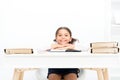 Studying on desk with incorrect height can lead back pain. What should be height of study table. Schoolgirl doing