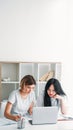 Studying together homework girls laptop notes home Royalty Free Stock Photo