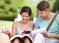 Studying, university and couple on steps with books on campus for learning, knowledge and reading. Education, students Royalty Free Stock Photo