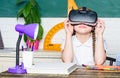 Studying in virtual reality. Modern technology. Interesting lesson. Virtual teaching. Homeschooling online. Girl kid Royalty Free Stock Photo