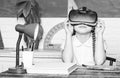 Studying in virtual reality. Modern technology. Interesting lesson. Virtual teaching. Homeschooling online. Girl kid Royalty Free Stock Photo