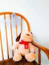 Stuffed Animal on Rocking Chair Against White Background