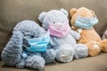 Stuffed animals teddy bear wearing face masks child game doctor pretend play Royalty Free Stock Photo