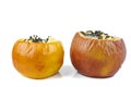 Stuffed baked apples with sezame seeds and walnuts isolated on a white Royalty Free Stock Photo