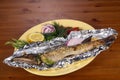 Stuffed baked pike with lemon