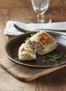 Stuffed cabbage roll - popular Polish dish on rustic wooden background.