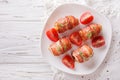 Stuffed chicken breast wrapped in bacon close-up. horizontal top Royalty Free Stock Photo