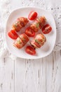 Stuffed chicken breast wrapped in bacon close-up. Vertical top v Royalty Free Stock Photo