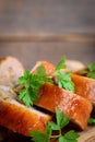 Chicken breast with filling. Baked chicken rolls, fresh parsley on a wooden board. How to make stuffed chicken breast Royalty Free Stock Photo