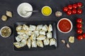 Stuffed conchiglie preparation, creamy ricotta and tomatoes sauce, top view Royalty Free Stock Photo