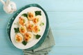 Stuffed or deviled eggs with paprika and parsley on blue plate for easter table. Traditional dish for Easter. Healthy diet food Royalty Free Stock Photo