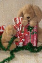 Stuffed dogs with Christmas presents.
