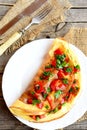 Stuffed egg omelet with vegetables on a plate. Healthy Breakfast recipe. Top view Royalty Free Stock Photo