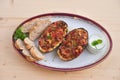 Stuffed Eggplant halves with tomato onion sweet pepper and cheese. Royalty Free Stock Photo