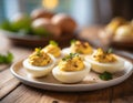 Stuffed eggs, deviled eggs on a small platter, on a wooden table, blurred background Royalty Free Stock Photo