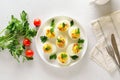 Stuffed eggs with egg yolk, bacon, mustard and parsley