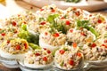 Stuffed eggs with ham, red pepper and dill Royalty Free Stock Photo