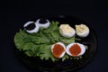 stuffed eggs with red caviar and black caviar on a lettuce leaf Royalty Free Stock Photo