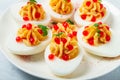 Stuffed eggs, with red caviar, micro greenery, Snack, on a white plate, top view, close-up, no people,