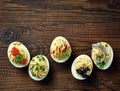 Stuffed eggs on wooden table Royalty Free Stock Photo