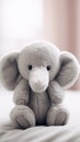 A stuffed elephant sitting on a bed, AI