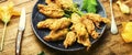 Stuffed fried zucchini flowers on the plate,extra wide Royalty Free Stock Photo