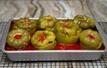 Stuffed Green Peppers in Tomato Sauce Cooling on Baker`s Rack Royalty Free Stock Photo