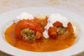 stuffed with meat 2 two with delicious pepper sauce and sour cream on the plate Royalty Free Stock Photo