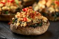 Stuffed mushrooms with spinach, bread crumbs and cheese on stone board Royalty Free Stock Photo