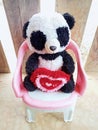 A stuffed panda holding a heart that says I love you is sitting Royalty Free Stock Photo