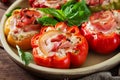 Stuffed peppers with cottage cheese and bacon in plate on the wooden table. Royalty Free Stock Photo