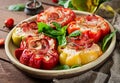 Stuffed peppers with cottage cheese and bacon in plate on the wooden table. Royalty Free Stock Photo