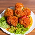 Stuffed peppers with rice and minced meat. Foreground. natural wooden background Royalty Free Stock Photo