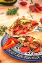 Stuffed pita bread with fried chicken with onions, lettuce leave Royalty Free Stock Photo