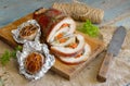 Stuffed Pork Loin Roast with baked garlic. Royalty Free Stock Photo