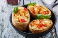 Stuffed potatoes with cheese and tomatoes Royalty Free Stock Photo