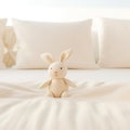 A stuffed rabbit on a bed in front of pillows, AI