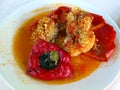 Stuffed red capsicum with rise served on a plate