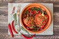 Stuffed red peppers with spicy tomato sauce and rosemary Royalty Free Stock Photo