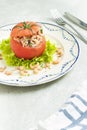 Stuffed Tomato with north sea shrimps served on a classic plate